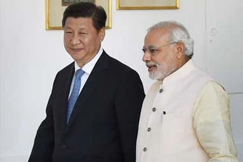 Chủ tịch Trung Quốc Tập Cận Bình và Thủ tướng Ấn Độ Narendra Modi. (Nguồn: firstpost.com)