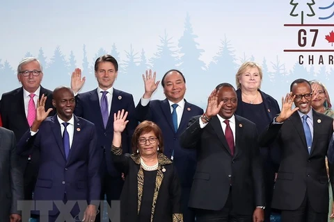 Thủ tướng Nguyễn Xuân Phúc và các trưởng đoàn G7 và G7 mở rộng. (Ảnh: Thống Nhất/TTXVN)