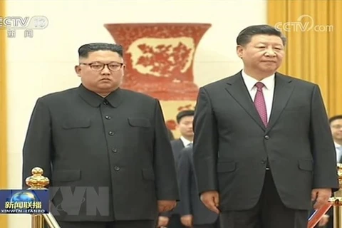 Nhà lãnh đạo Triều Tiên Kim Jong-un và Chủ tịch Trung Quốc Tập Cận Bình. (Nguồn: Yonhap/TTXVN)
