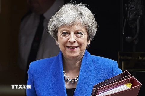Thủ tướng Anh Theresa May tới dự phiên điều trần tại Hạ viện Anh ở thủ đô London ngày 20/6. (Ảnh: AFP/TTXVN)