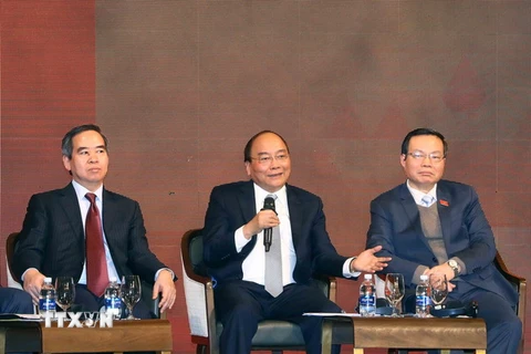 Thủ tướng Nguyễn Xuân Phúc đối thoại tại Diễn đàn kinh tế Việt Nam năm 2018. (Ảnh: Thống Nhất/TTXVN)