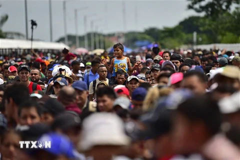 Người di cư tại khu vực Ciudad Hidalgo, bang Chiapas, Mexico, trong hành trình tới Mỹ. (Ảnh: AFP/TTXVN)