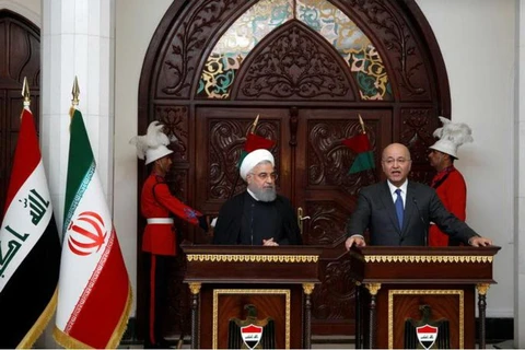 Tổng thống Iran Hassan Rouhani (trái) và Tổng thống Iraq Barham Salih. (Nguồn: Reuters)