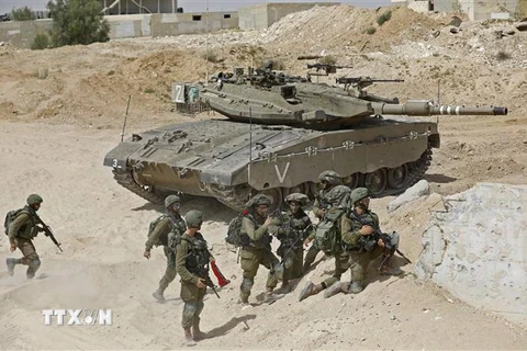Binh sỹ Israel tham gia cuộc diễn tập quân sự với tình huống chiến tranh tại Dải Gaza tại căn cứ quân sự Tzeelim ngày 3/7/2018. (Ảnh: AFP/TTXVN)