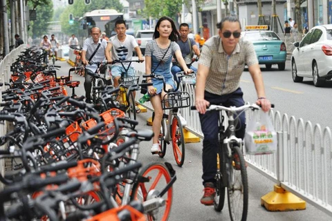 Người dân Vũ Hán (Trung Quốc) tham gia chương tình chia sẻ xe đạp. (Nguồn: Reuters)