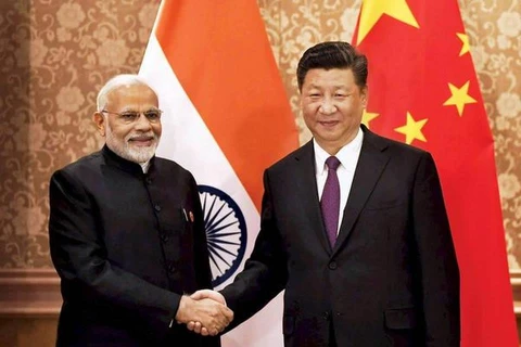 Chủ tịch Trung Quốc Tập Cận Bình và Thủ tướng Ấn Độ Narendra Modi. (Nguồn: PTI)