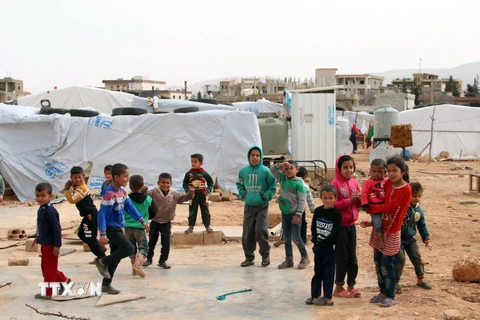 Người di cư Syria tại một trại tị nạn ở thung lũng Bekaa, Liban. (Ảnh: AFP/TTXVN)