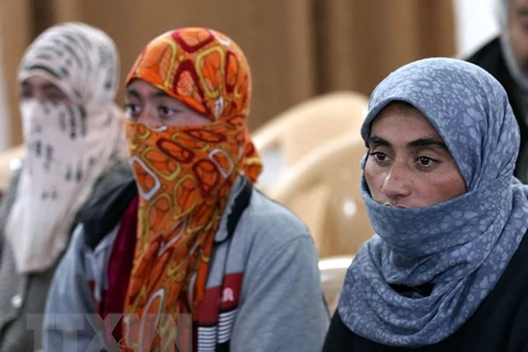 Các con tin người Yazidi được IS trả tự do. (Nguồn: AFP/TTXVN)