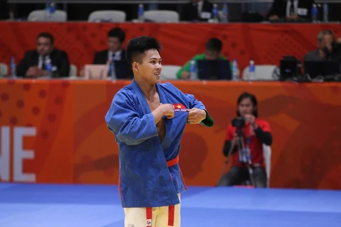 Vũ Ngọc Sơn đoạt thêm huy chương vàng ở hạng dưới 73kg của nam. (Nguồn: Vietnam+)