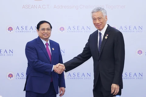[Photo] Thủ tướng Phạm Minh Chính gặp Thủ tướng Singapore, Australia