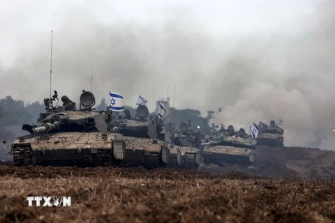 Binh sĩ Israel trở về phần lãnh thổ của Nhà nước Do Thái, giáp giới Dải Gaza ngày 28/1/2024. (Ảnh: AFP/TTXVN)
