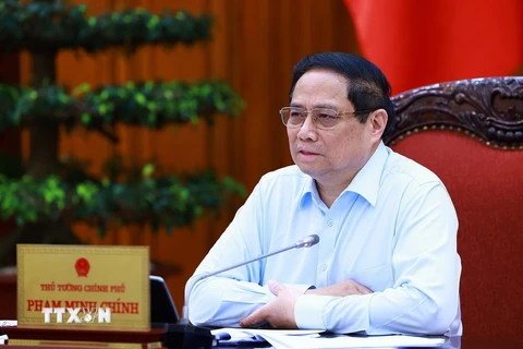Thủ tướng Phạm Minh Chính chủ trì họp thúc đẩy tiến độ triển khai dự án đường dây 500kv mạch 3 và cung ứng điện tháng cao điểm. (Ảnh: Dương Giang/TTXVN)
