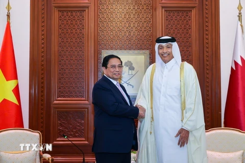 Thủ tướng Phạm Minh Chính hội kiến Chủ tịch Quốc hội Qatar Hassan bin Abdullah Al-Ghanim. (Ảnh: Dương Giang/TTXVN)