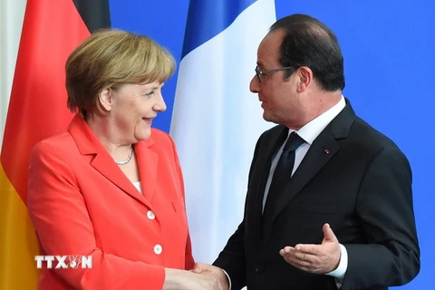 Thủ tướng Đức Angela Merkel và Tổng thống Pháp Francois Hollande. (Nguồn: AFP/TTXVN)