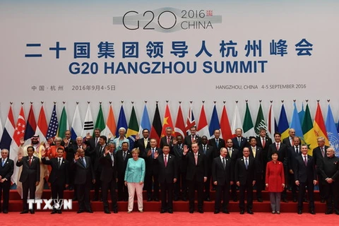 Các nhà lãnh đạo G20 chụp ảnh chung tại hội nghị. (Nguồn: AFP/TTXVN)