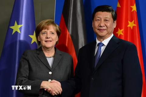 Chủ tịch Trung Quốc Tập Cận Bình và Thủ tướng Đức Angela Merkel (trái). (Nguồn: AFP/TTXVN)