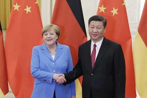 Chủ tịch Trung Quốc Tập Cận Bình và Thủ tướng Đức Angela Merkel. (Ảnh: AFP) 