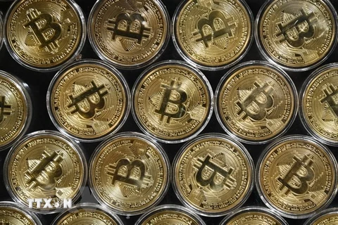 Đồng tiền kỹ thuật số bitcoin. (Ảnh: AFP/TTXVN) 