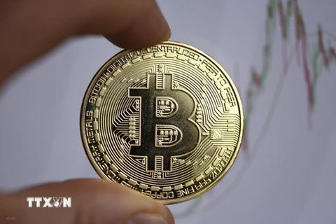 Đồng tiền kỹ thuật số Bitcoin. (Ảnh: AFP/TTXVN) 