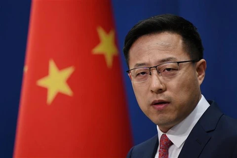Người phát ngôn Bộ Ngoại giao Trung Quốc Triệu Lập Kiên tại một cuộc họp báo ở Bắc Kinh. (Ảnh: AFP/TTXVN)