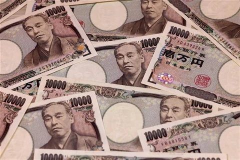 Đồng tiền mệnh giá 10.000 yen tại Tokyo (Nhật Bản). (Ảnh: AFP/TTXVN)