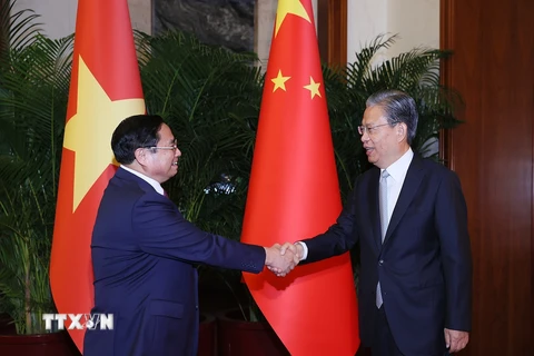 Thủ tướng Phạm Minh Chính hội kiến Ủy viên trưởng Nhân đại toàn quốc Trung Quốc Triệu Lạc Tế. (Ảnh: Dương Giang/TTXVN)