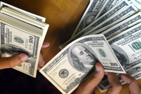 Chỉ số đồng USD của Bloomberg đã tăng hơn 4% trong năm nay. (Ảnh: AFP/TTXVN)
