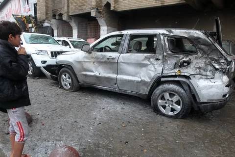 Một vụ đánh bom xe nhằm vào khu vực sinh sống của người Shiite ở Baghdad, tháng 11/2013. (Nguồn: AFP/TTXVN) 
