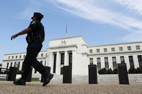 Fed tiếp tục giảm quy mô QE3 và duy trì lãi suất cực thấp
