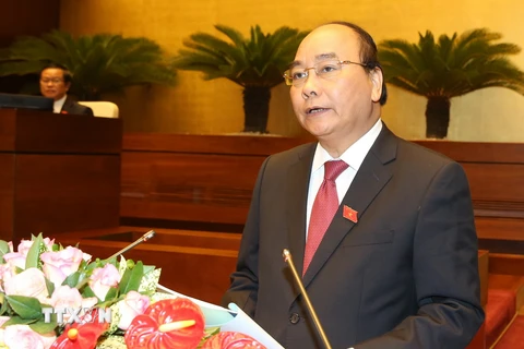 Thủ tướng Nguyễn Xuân Phúc trình bày Báo cáo trước Quốc hội. (Ảnh: Thống Nhất/TTXVN)