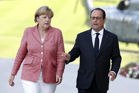 Thủ tướng Đức Angela Merkel và Tổng thống Pháp Francois Hollande. (Nguồn: EPA)