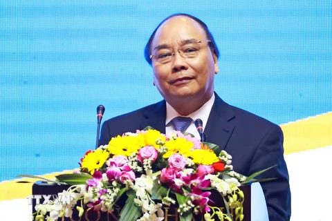 Thủ tướng Nguyễn Xuân Phúc phát biểu tại Hội nghị Xúc tiến đầu tư tỉnh Quảng Nam. (Ảnh:Thống Nhất/TTXVN)