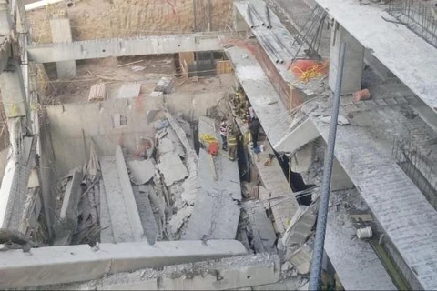 Hiện trường vụ sập công trình xây dựng. (Nguồn: UPI)