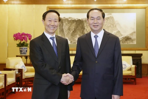 Chủ tịch nước Trần Đại Quang tiếp đồng chí Vương Gia Thuỵ, Phó Chủ tịch Chính hiệp Trung Quốc tới chào xã giao. (Ảnh: Nhan Sáng/TTXVN)