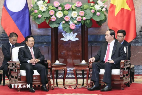 Chủ tịch nước Trần Đại Quang tiếp ông Phankham Viphavan, Ủy viên Bộ Chính trị, Thường trực Ban Bí thư, Phó Chủ tịch nước Lào. (Ảnh: Nhan Sáng/TTXVN)