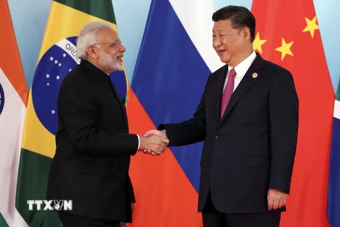 Chủ tịch Trung Quốc Tập Cận Bình đón tiếp Thủ tướng Ấn Độ Narendra Modi tại hội nghị BRICS ở Hạ Môn, Trung Quốc. (Nguồn: EPA/TTXVN)