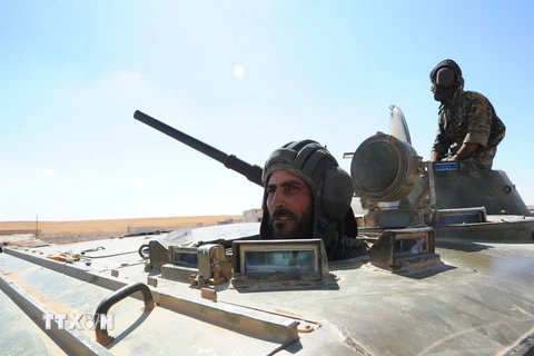 Quân đội Syria sau khi giành lại thị trấn Hama. (Nguồn: THX/TTXVN)