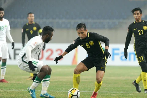 Các cầu thủ U23 Malaysia (áo đen) trong trận đấu với U23 Saudi Arabia. (Nguồn: AFC)