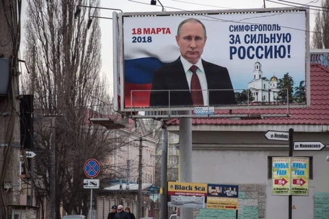 Hình ảnh Tổng thống Nga Putin ở Simferopol, Crimea, ngày 9/3. (Nguồn: AFP)