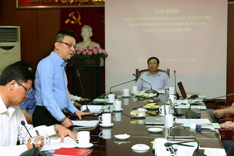 Phó Tổng Giám đốc Thông tấn xã Việt Nam Lê Quốc Minh tham luận tại buổi toạ đàm. (Ảnh: Nguyễn Dân/TTXVN)