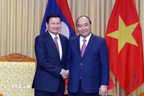 Hình ảnh hai Thủ tướng Việt-Lào chủ trì kỳ họp Ủy ban Liên Chính phủ 