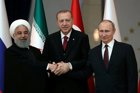 Tổng thống Nga Vladimir Putin và các nhà lãnh đạo của Thổ Nhĩ Kỳ và Iran. (Nguồn: Reuters)