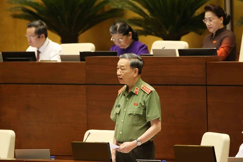 Bộ trưởng Bộ Công an Tô Lâm trả lời chất vấn của đại biểu Quốc hội sáng 4/6. 