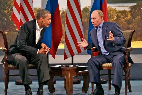Tổng thống Nga Vladimir Putin và người đồng cấp Mỹ Barack Obama. (Nguồn: EPA)