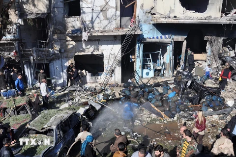Hiện trường một vụ đánh bom xe ở Homs, Syria do tổ chức IS gây ra. (Nguồn: AFP/TTXVN)
