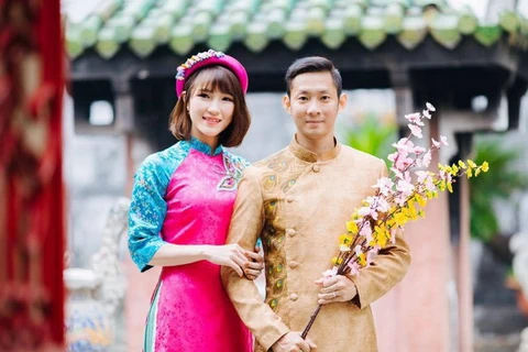 Vũ Thị Trang đang hạnh phúc bên người chồng, đồng nghiệp, đàn anh Nguyễn Tiến Minh. (Ảnh: Facebook nhân vật)