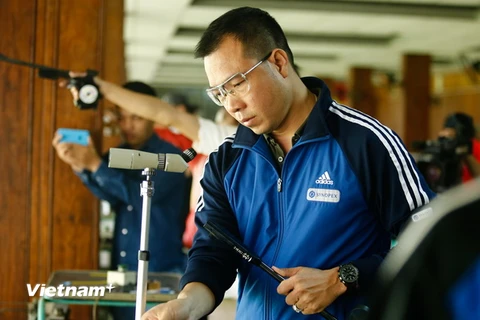 Xuân Vinh mất cơ hội nâng cao thành tích giành Huy chương bạc 50m súng ngắn bắn chậm ở Olympic. (Ảnh: Minh Chiến/Vietnam+)