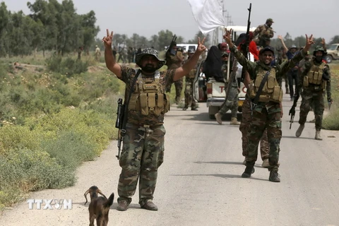 Lực lượng ủng hộ Chính phủ Iraq giành lại quyền kiểm soát làng Sayed Ghareeb, gần Dujail, cách thủ đô Baghdad 70km về phía bắc từ phiến quân IS ngày 2/6. (Nguồn: AFP/TTXVN)
