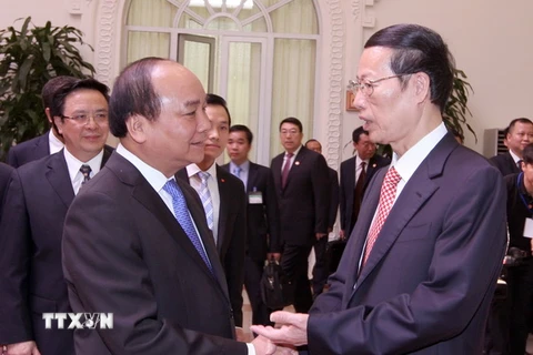 Phó Thủ tướng Chính phủ Nguyễn Xuân Phúc đón và hội đàm với Phó Thủ tướng Quốc vụ viện Trung Quốc Trương Cao Lệ. (Ảnh: Thống Nhất/TTXVN)