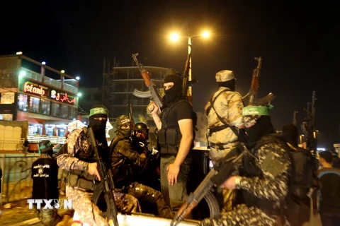 Các thành viên phong trào Hamas tại thành phố Gaza ngày 29/6. AFP/TTXVN